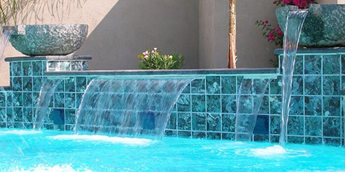 pool using grey blue porcelain mosaic tile for water feature backsplash.jpg